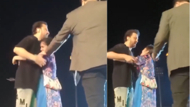 Fan Jampa on stage and Atif Aslam on his neck during live concert