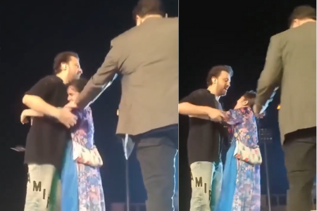 Fan Jampa on stage and Atif Aslam on his neck during live concert