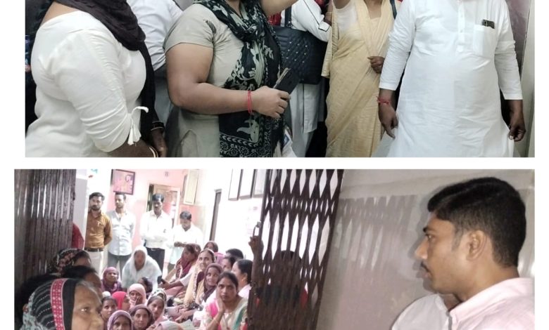 Asha workers staged a sit-in outside the gate of the chief medical officer at Saharanpur district hospital