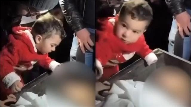One-year-old daughter emotionally calling out "Papa" beside the martyr Amjad Khan’s coffin during his funeral in Udhampur, Jammu & Kashmir.