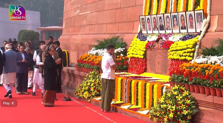 **ALT Text:** Congress leaders Mallikarjun Kharge and Priyanka Gandhi paying tribute to martyrs on Parliament attack anniversary