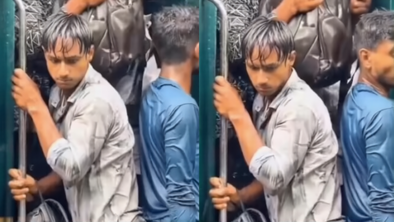 Passenger Hanging From Train: A chilling video depicting torrential rain and a fight to the death, a video of a young man hanging from the door of a packed train goes viral.