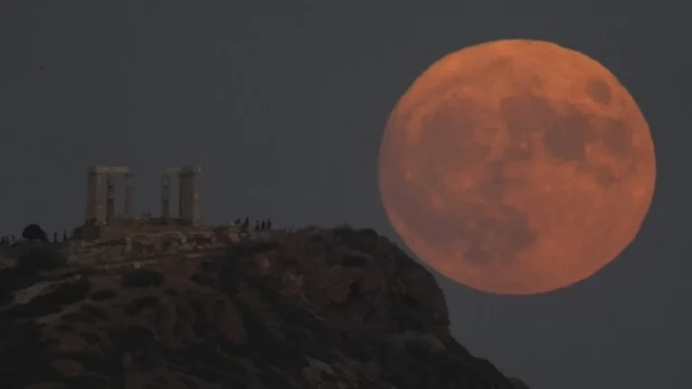 Blue Moon 2026 India: Rare Blue Moon 2026 rising over the Indian horizon with a reddish-orange glow during sunset, creating a stunning celestial view in the evening sky.