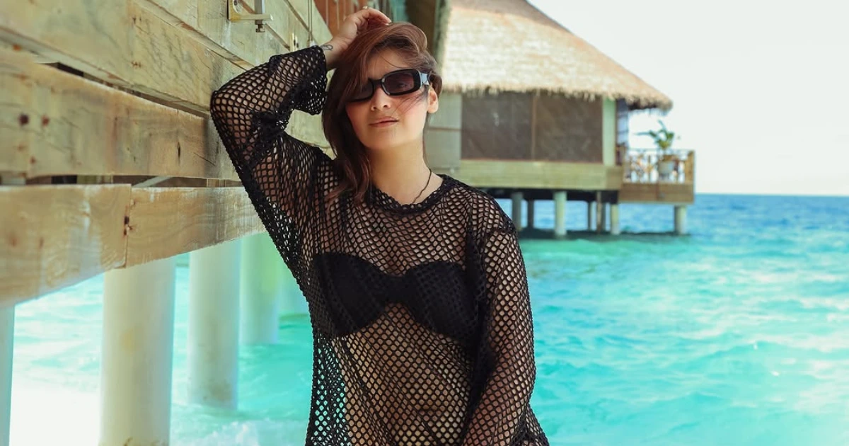 Aarti Singh Maldives Bikini Photos: Aarti Singh posing in a stylish black bikini and net top during her Maldives vacation with husband Deepak Chauhan.