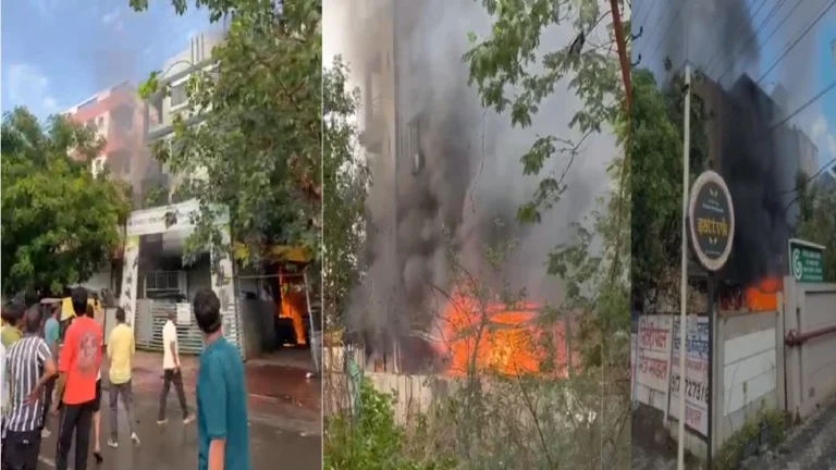 Indore Electric Vehicle Showroom Fire: Firefighters and local residents rescue trapped people from a burning electric vehicle showroom in Indore using wooden ladders connected between neighboring rooftops.