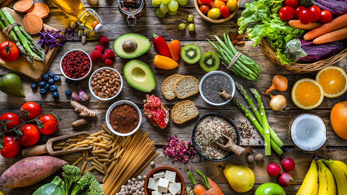 Healthy Diet Cost: Fresh fruits, vegetables, grains, and dairy products displayed at a market, highlighting the rising cost of a healthy diet in India.