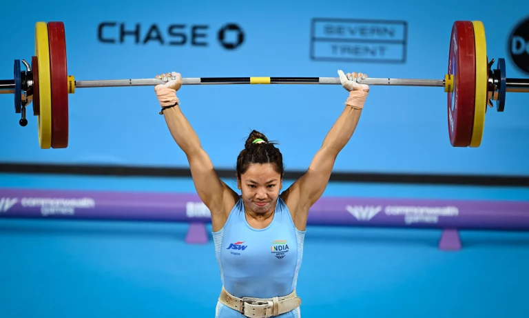 Mirabai Chanu celebrates after winning her third consecutive Commonwealth Games gold medal in women's weightlifting at the 2026 Commonwealth Games.