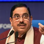 Prahlad Joshi addressing the media after receiving additional charge of the Education Ministry following Pradhan's resignation.